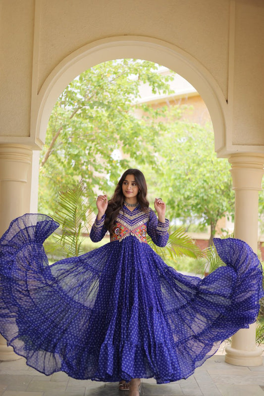 Vibrant Bandhani Printed Faux Georgette Gown with Kutchi Patchwork Yoke & 12-Meter Flair